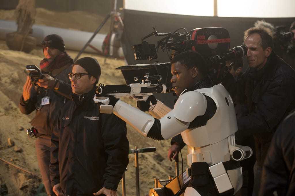 Star Wars: The Force Awakens L to R: Director J.J. Abrams on set w/ John Boyega (Finn). Ph: David James ©Lucasfilm 2015