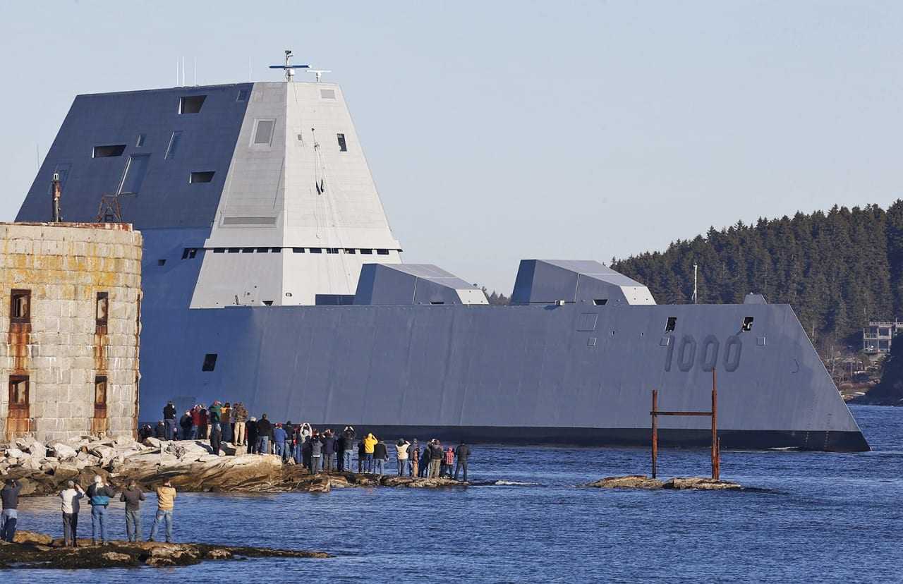 The first Zumwalt-class destroyer, USS Zumwalt, the largest ever built for the U.S. Navy, passes spectators at Fort Popham at the mouth of the Kennebec River in Phibbsburg, Maine, Monday, Dec. 7, 2015, in Bath, Maine. The ship is headed out to sea for the first time to undergo sea trials. (AP Photo/Robert F. Bukaty)