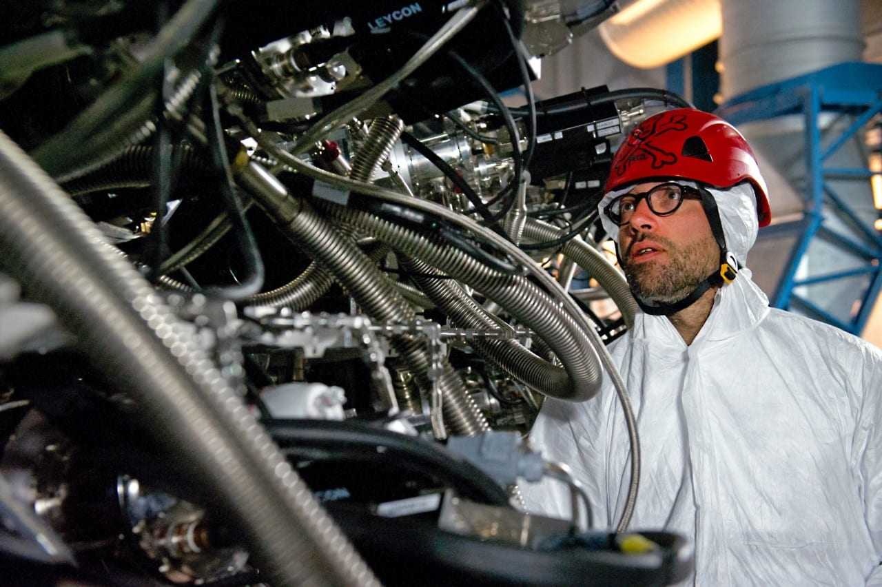 An engineer tests the complex wiring which makes up thew new instrument, MUSE – Multi Unit Spectroscopic Explorer. MUSE is a second generation instrument in development for the Very Large Telescope (VLT) of the European Southern Observatory (ESO). It is a panoramic integral-field spectrograph operating in the visible wavelength range. It combines a wide field of view with the improved spatial resolution provided by adaptive optics and covers a large simultaneous spectral range. MUSE couples the discovery potential of an imaging device to the measuring capabilities of a spectrograph, while taking advantage of the increased spatial resolution provided by adaptive optics. This makes it a unique and powerful tool for discovering objects that cannot be found in imaging surveys.
